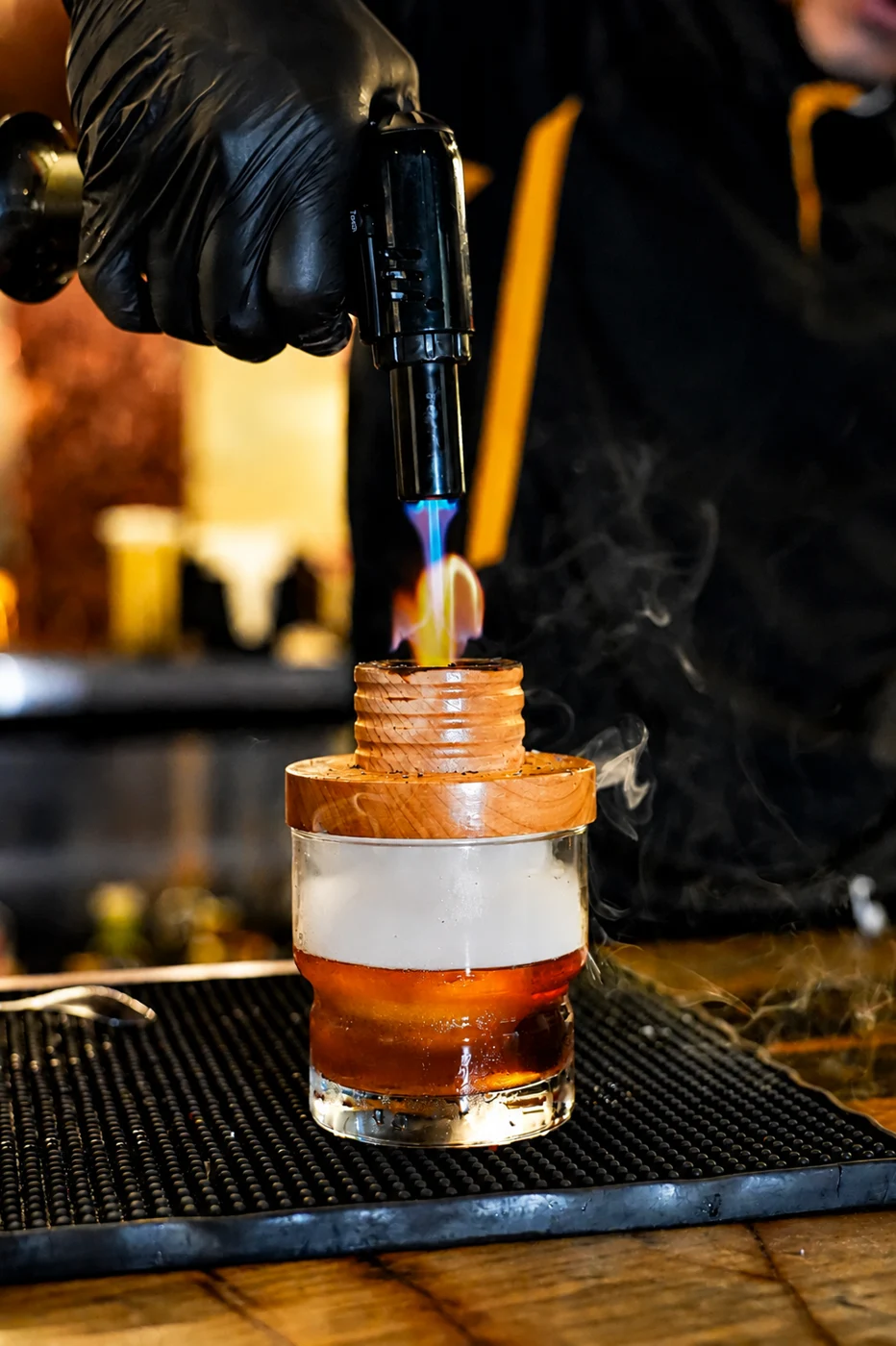 A bartender adds the final touch to a cocktail